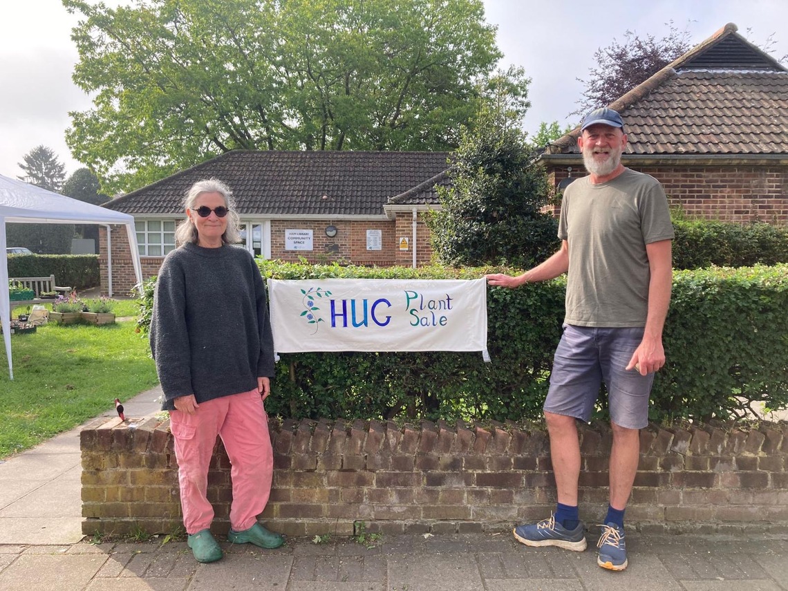 Directors with banner outside library
